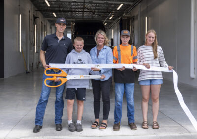 The Wood family cutting the ribbon to celebrate Woody's Trucking's new wash-bay and building expansion